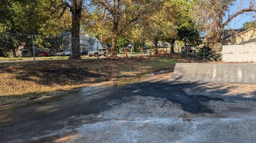 Lengthy skid marks, debris and damaged skate park remain after deadly overnight Guthrie crash